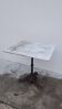 Bistro pedestal table in marble and cast iron lion paws