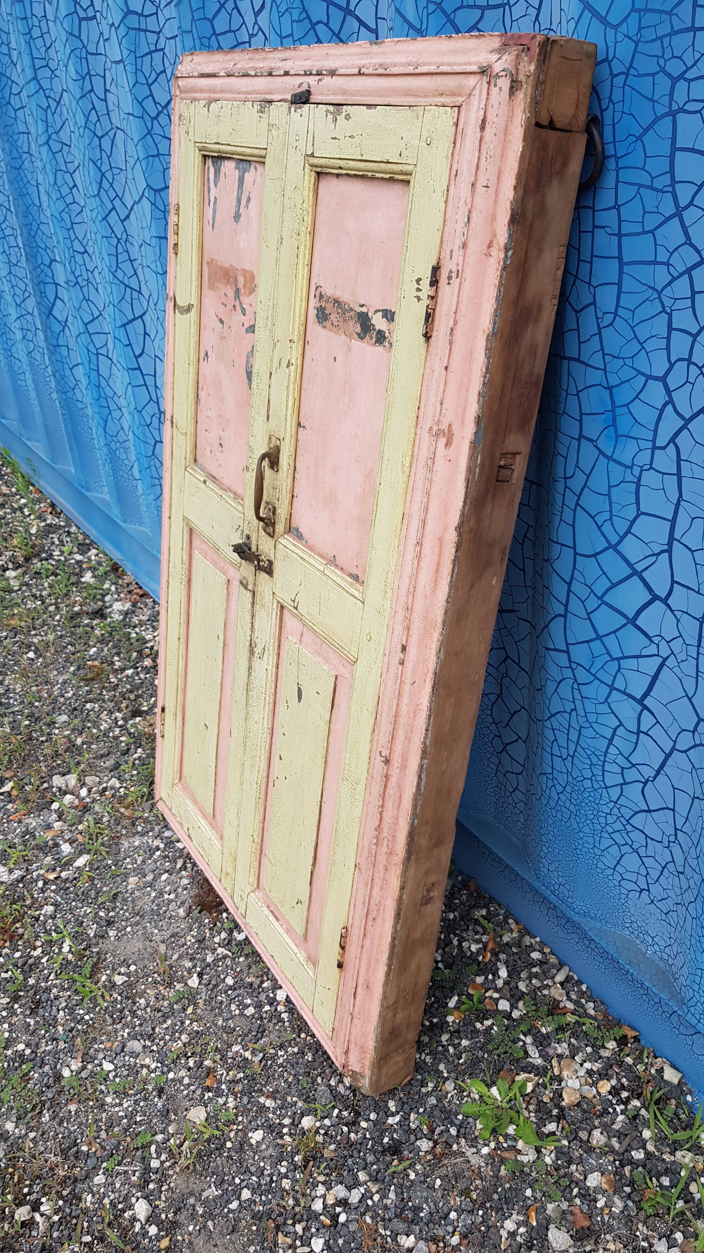 Old polychrome Burmese teak window with interior mirror.
