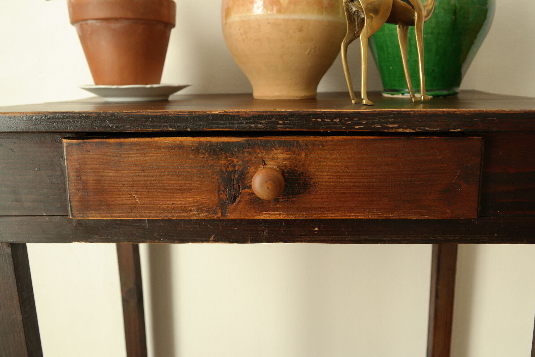 Old country side table in waxed wood