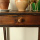 Old country side table in waxed wood