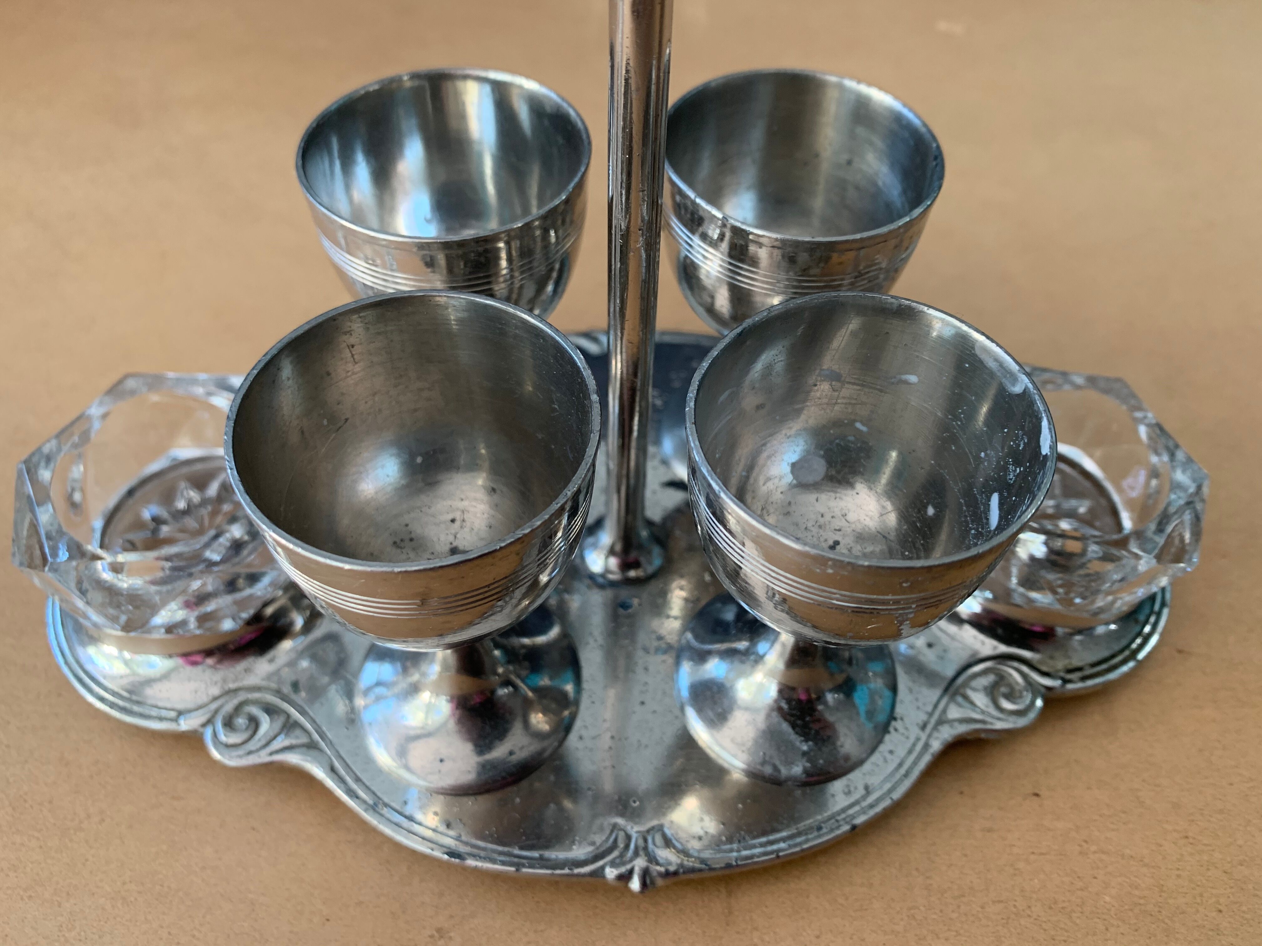 Old serving for boiled eggs with 4 metal cockroaches