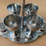 Old serving for boiled eggs with 4 metal cockroaches