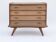 Renovated vintage commode from the 1960s in oak with slanted profile and tapered legs.