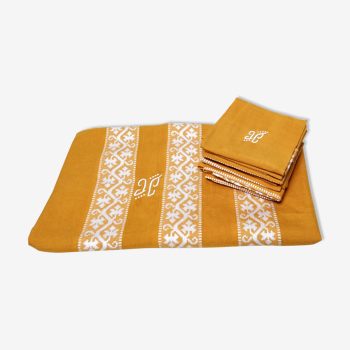 Mustard yellow tablecloth with towels