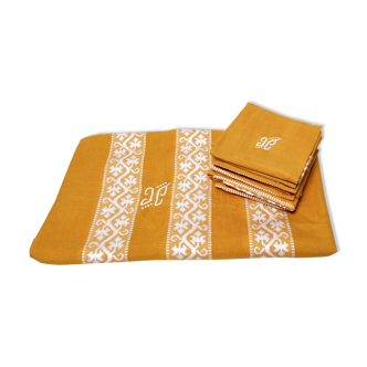 Mustard yellow tablecloth with towels