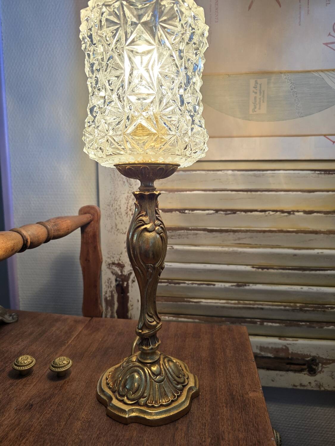 Vintage table lamp with a bronze base and moulded glass globe.