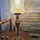 Vintage table lamp with a bronze base and moulded glass globe.