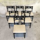 Set of six black lacquered wooden chairs.
