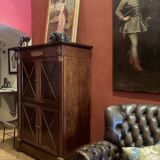 Cabinet, wardrobe or mahogany and ormolu wine bar in French Empire style with four doors.