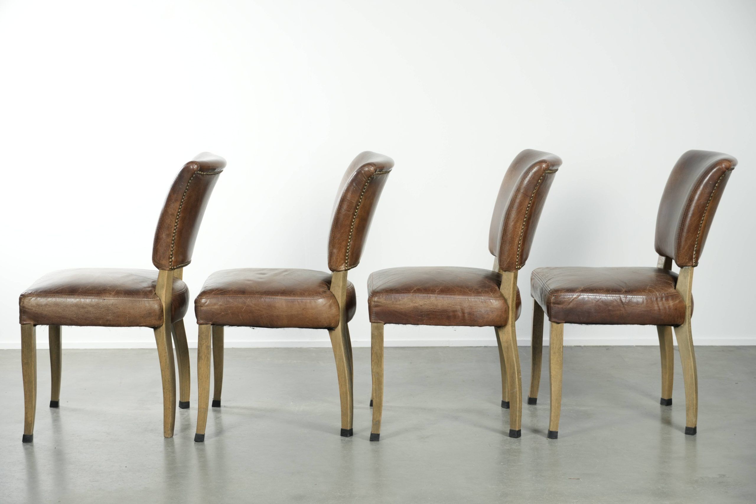 Set of 4 vintage cowhide and wooden dining chairs