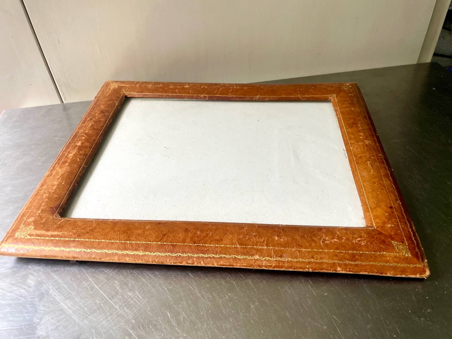 Antique  leather  with gilding frame measurements 31 cm x 25 cm