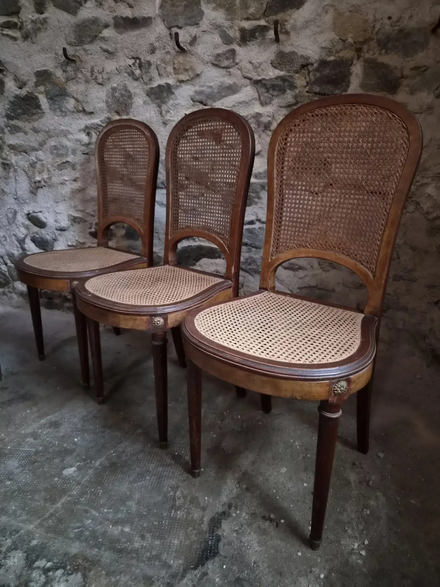 Set of 6 antique Louis XVI style dining chairs with caning.