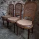 Set of 6 antique Louis XVI style dining chairs with caning.