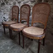 Set of 6 antique Louis XVI style dining chairs with caning.