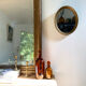 Oval mirror in gilded wood