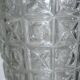 Transparent glass vase with art deco geometric patterns