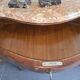 Curved support furniture in floral marquetry – Louis XV style, marble top, late 19th century.