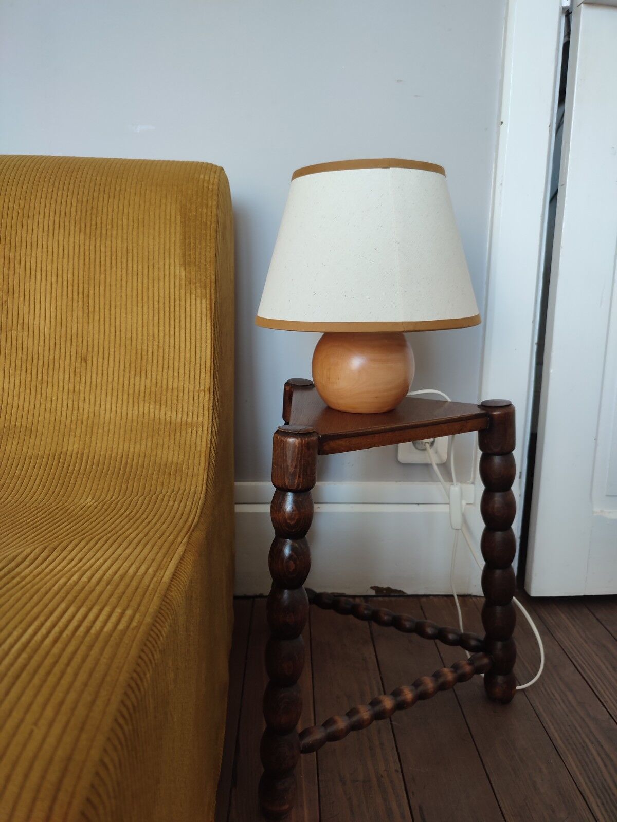 Wood tripod sofa end
