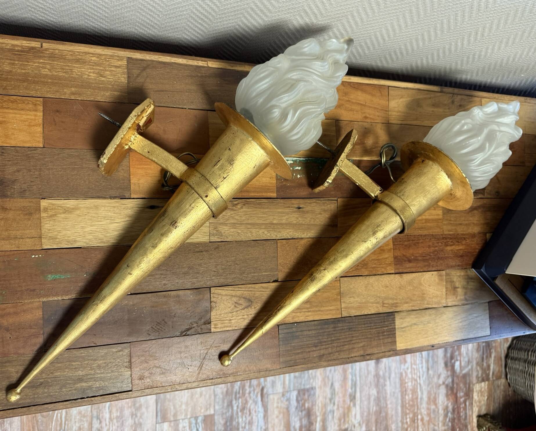 Pair of large medieval-style torchiere lamps in gilded metal