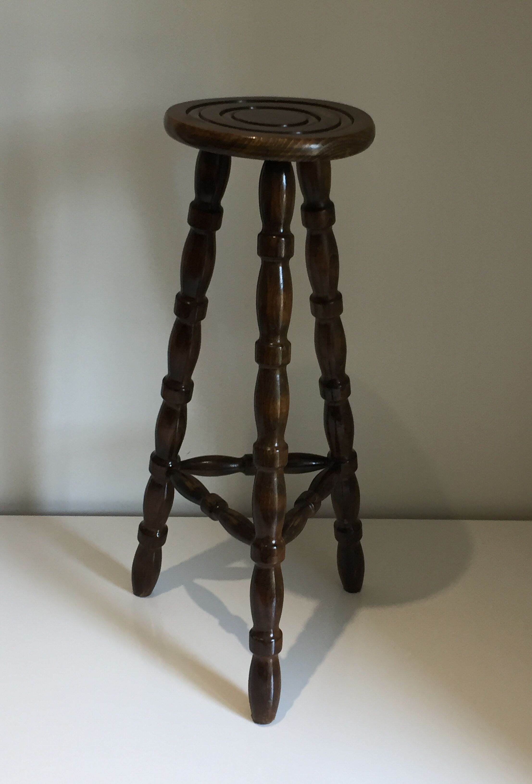 High tripod stool in turned wood