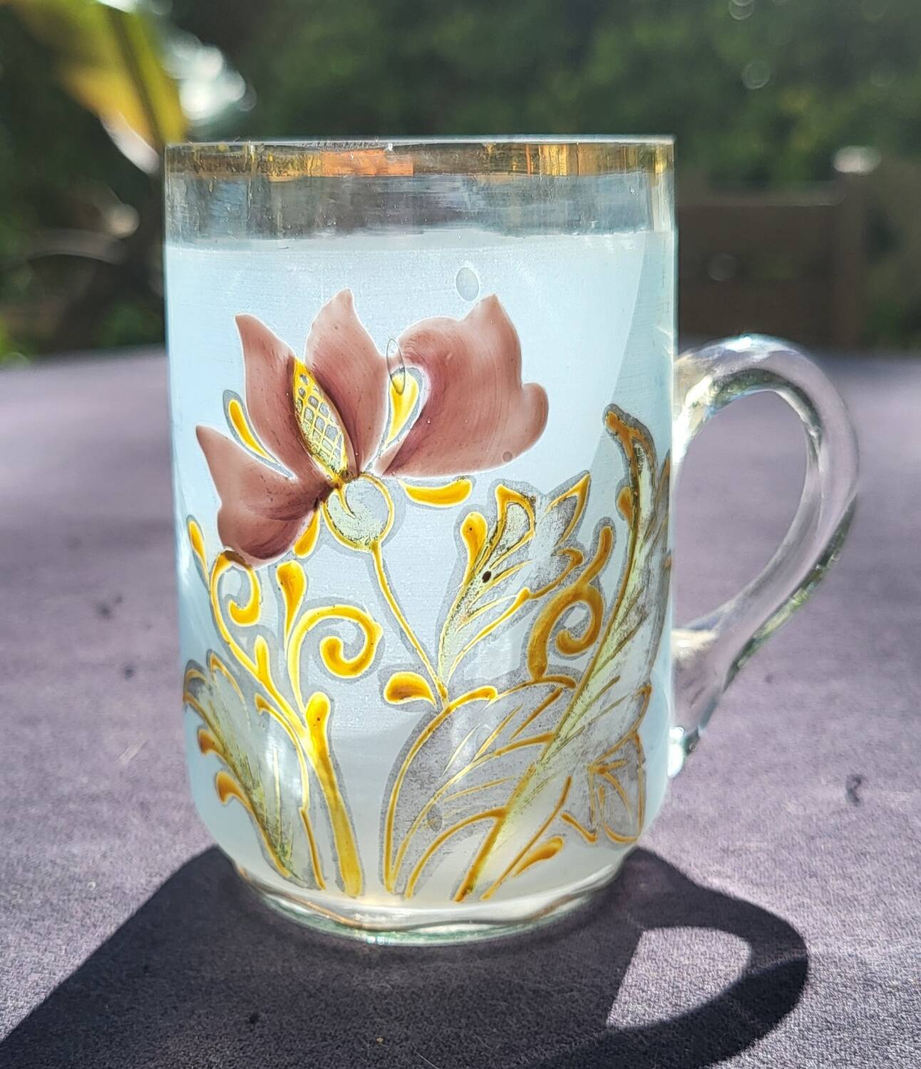 Old enameled blown glass cup