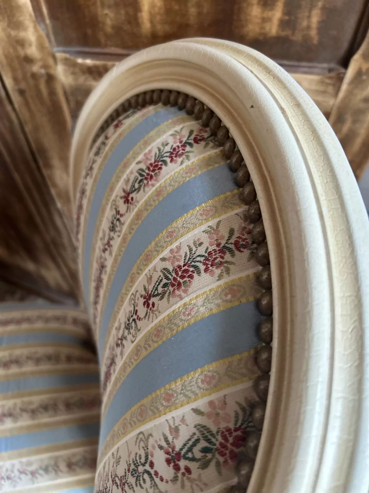 Pair of Louis XVI style chairs in painted wood and satin, classic elegance.