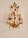 Hand-forged wall lamp gilded with gold leaf and crystals, Italy