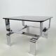 Table basse métal chromé et verre fumé 70
