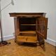 Wooden TV unit with a rotating top.