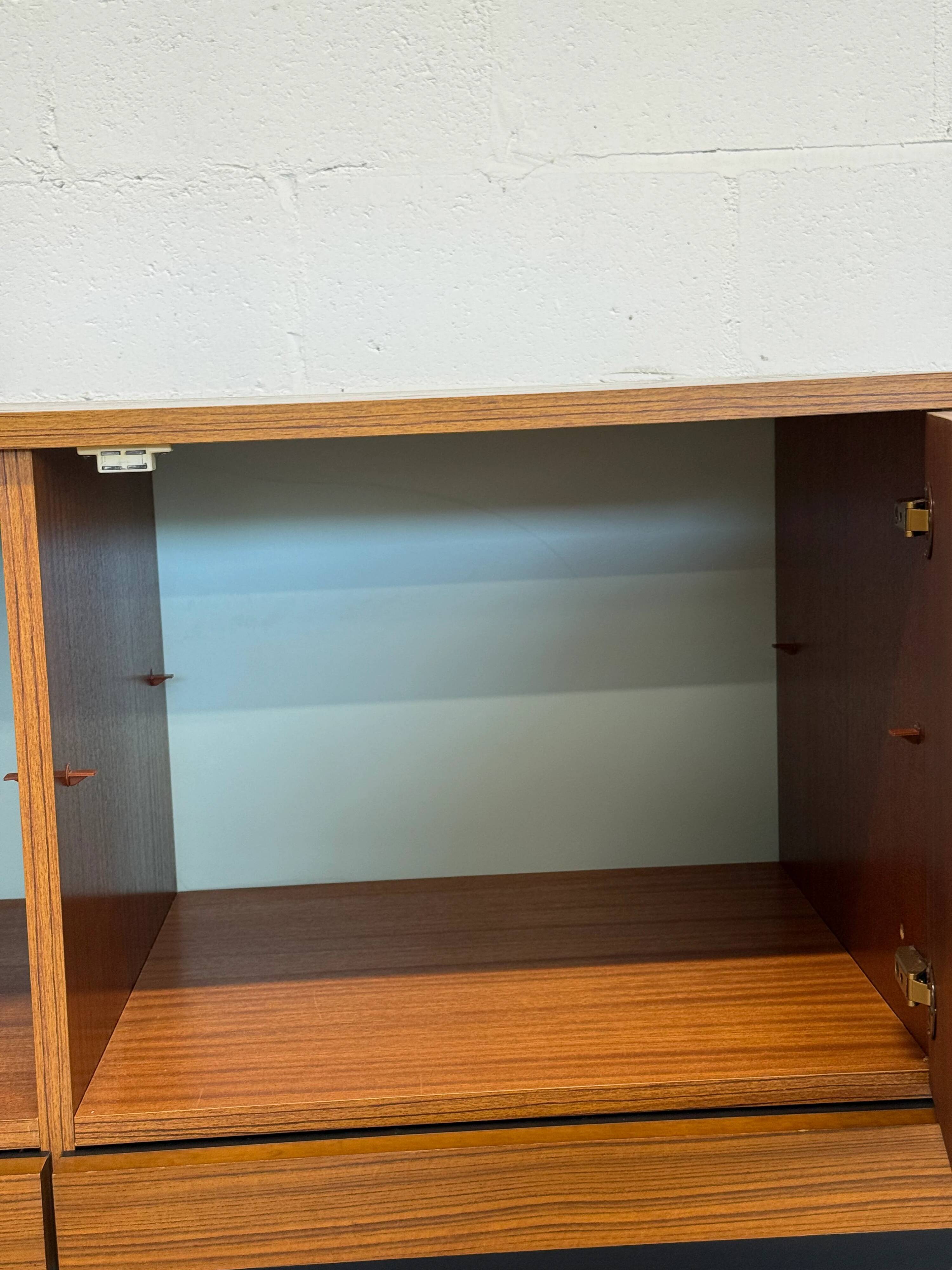 Vintage teak sideboard, mid-century style, with doors and drawers.