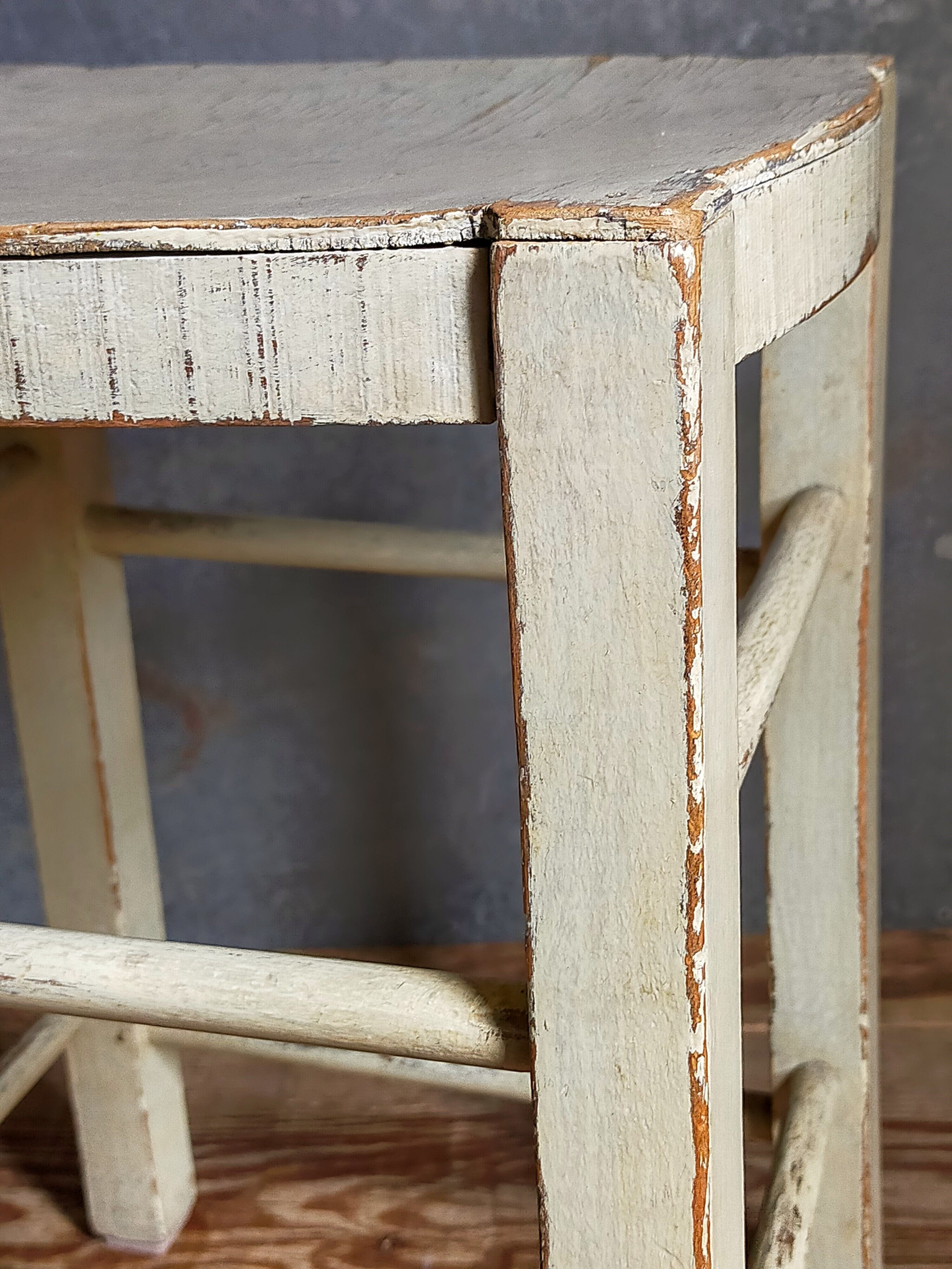 Old patinated painted wooden stool