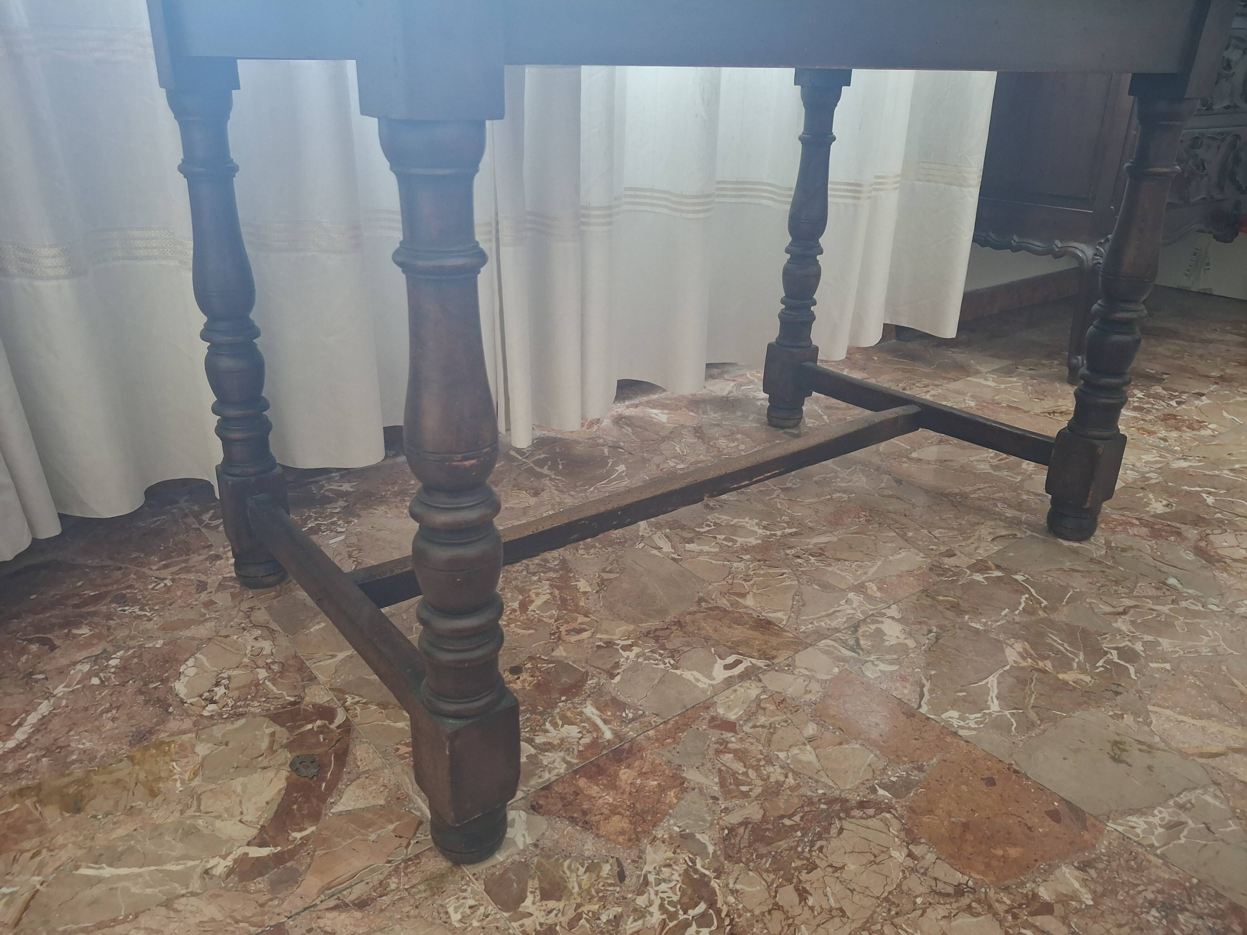 1960s Italian wooden table with a glass top.