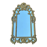 Grand miroir à parecloses en bois sculpté et doré, de style Régence