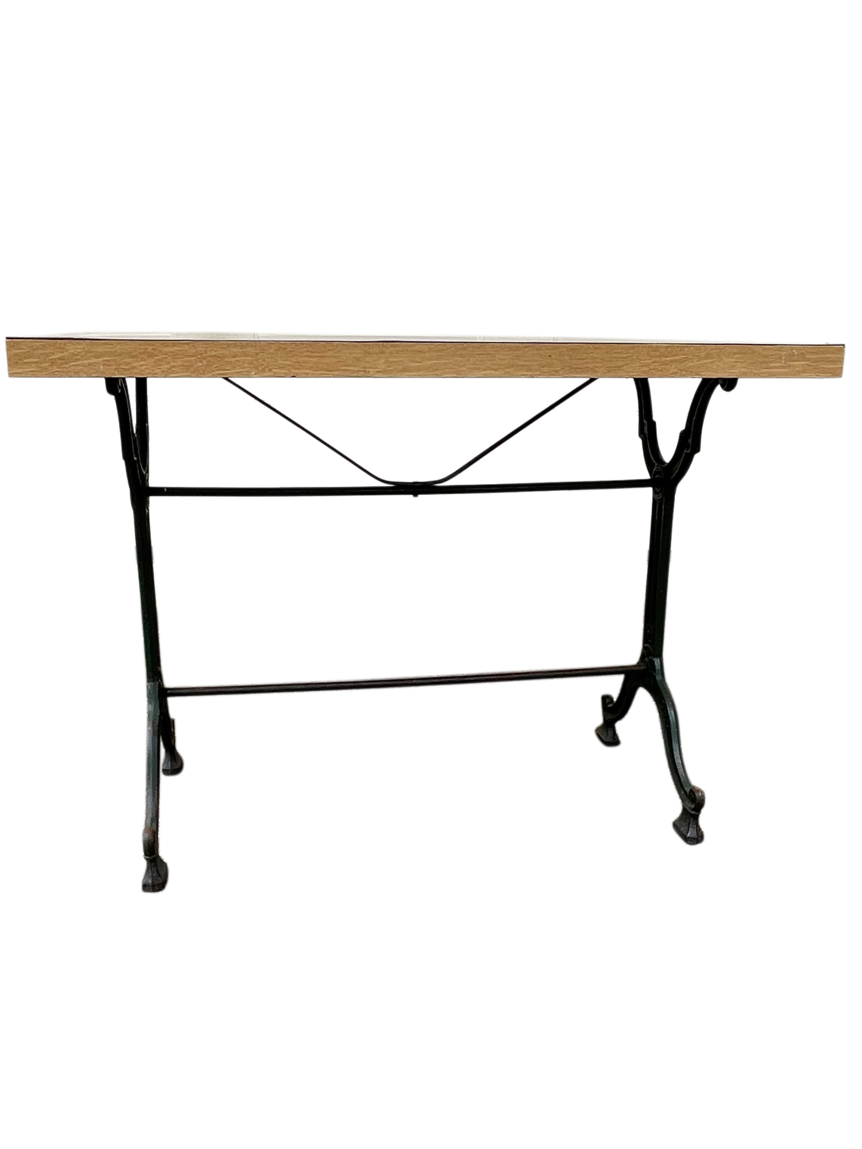 Old bistro table in engraved wrought iron