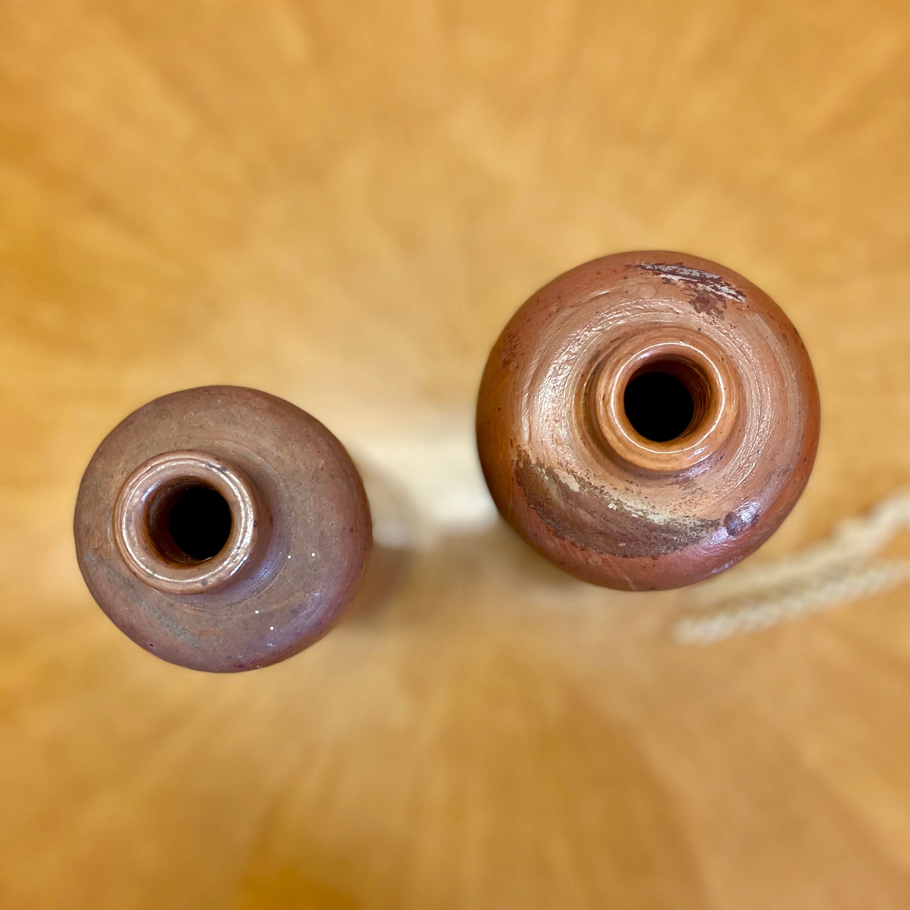 Set of two bottles or jugs in ocher-brown enamelled sandstone