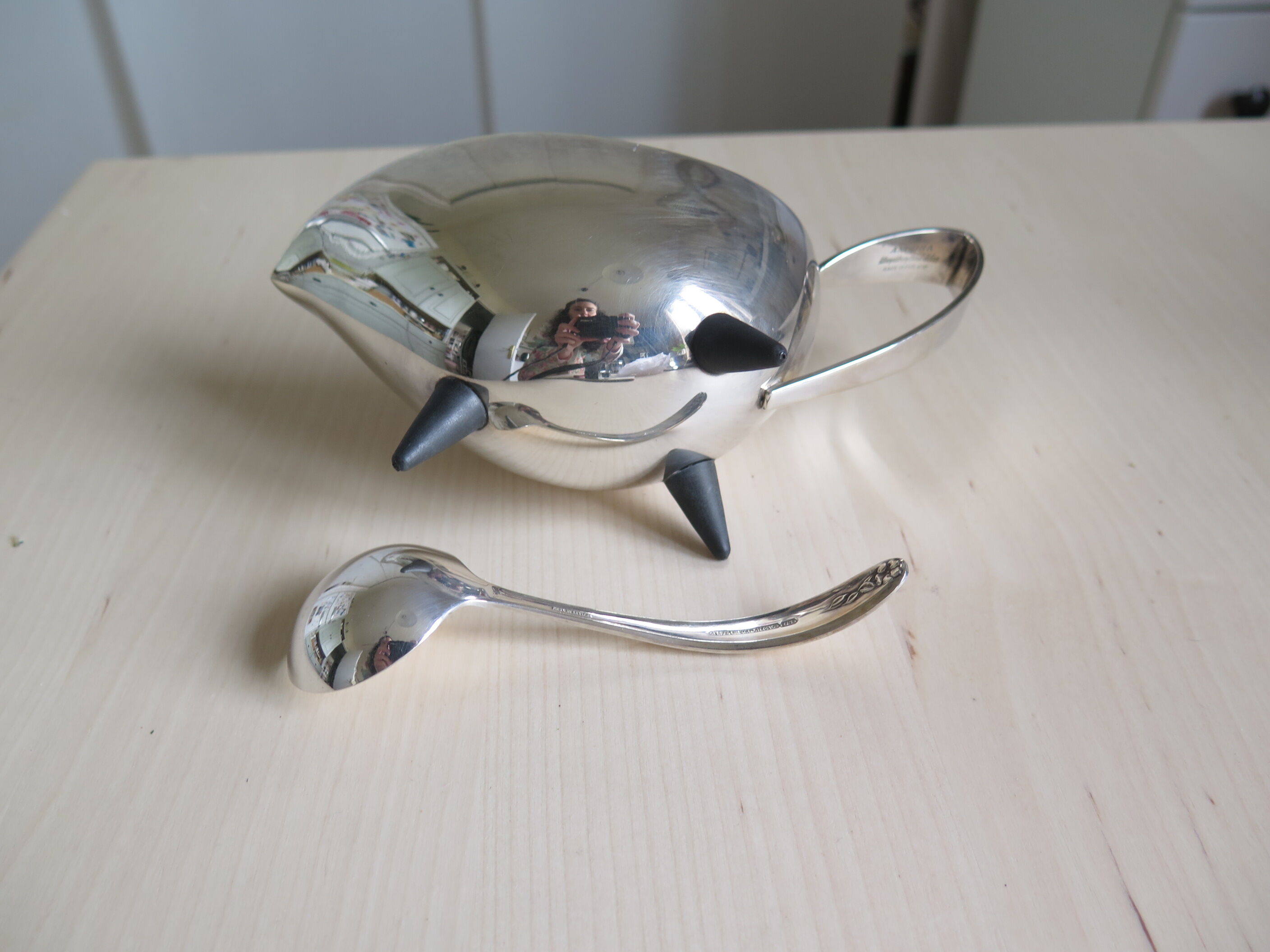 Angora tripod and silver metal spoon
