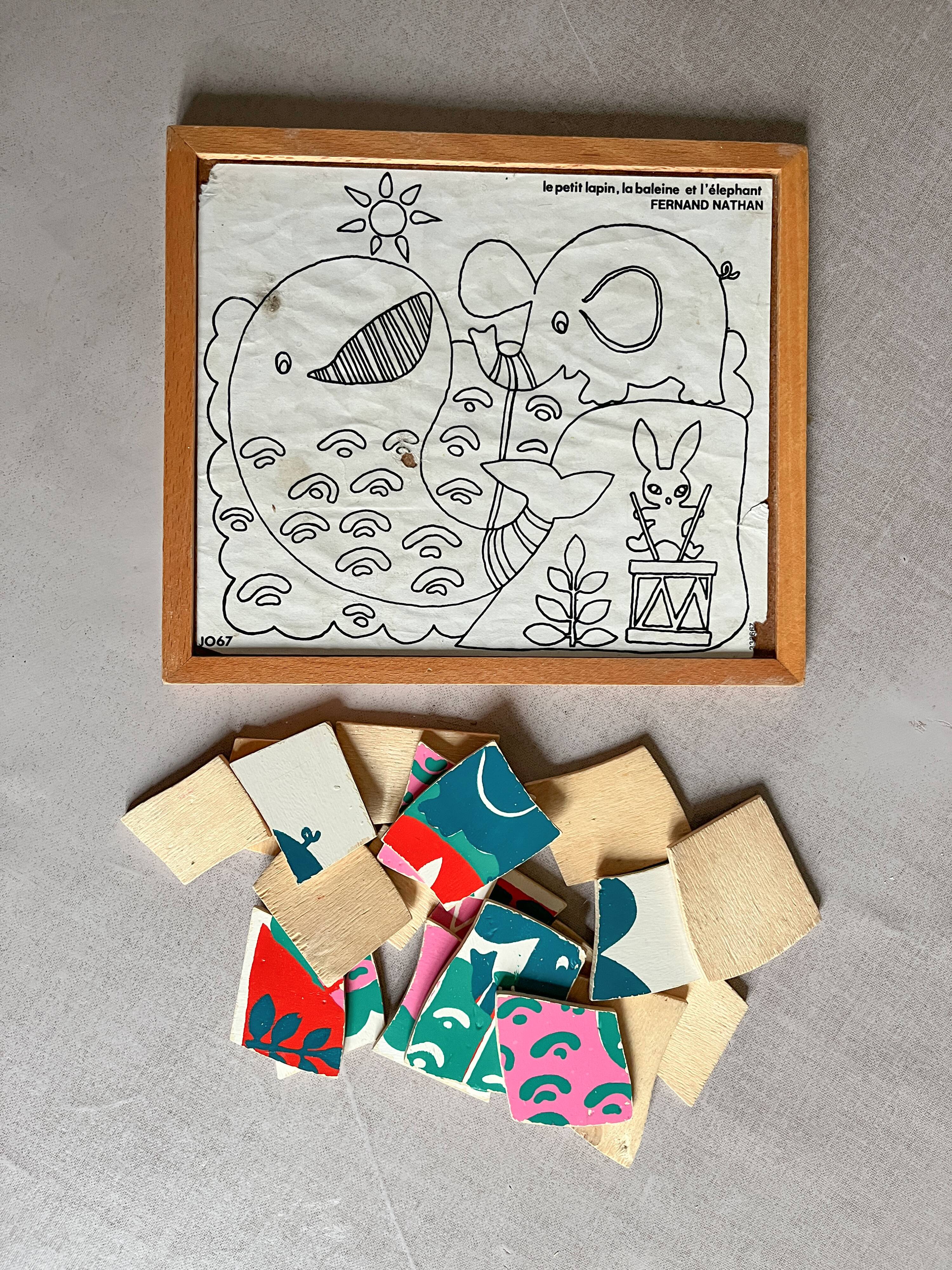 Wooden frame puzzle from the 1940s/50s depicting a pink whale.