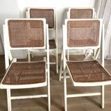 4 folding chairs with wicker seating