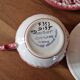Henriot in Quimper - Set of 2 cups and saucers with a floral design.
