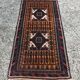 Vintage Persian Baluch rug, hand-knotted wool, 1970.