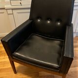 Modernist armchair in wood and black synthetic leather, circa 1960