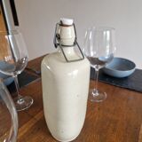 Old bottle of beige sandstone hot water bottle