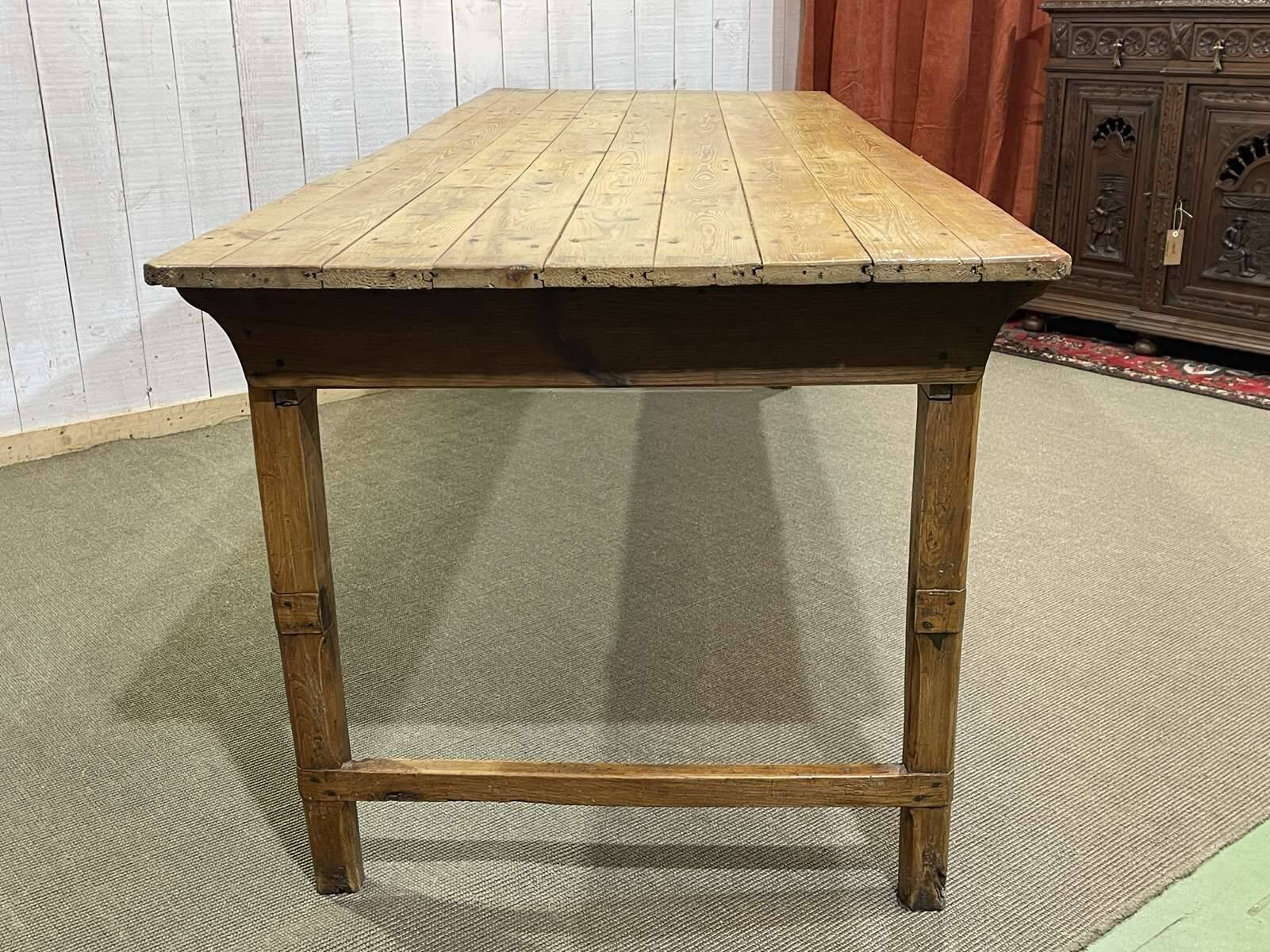 Early 20th-century farmhouse table made of fir, elm, and chestnut.