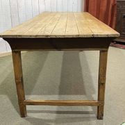 Early 20th-century farmhouse table made of fir, elm, and chestnut.
