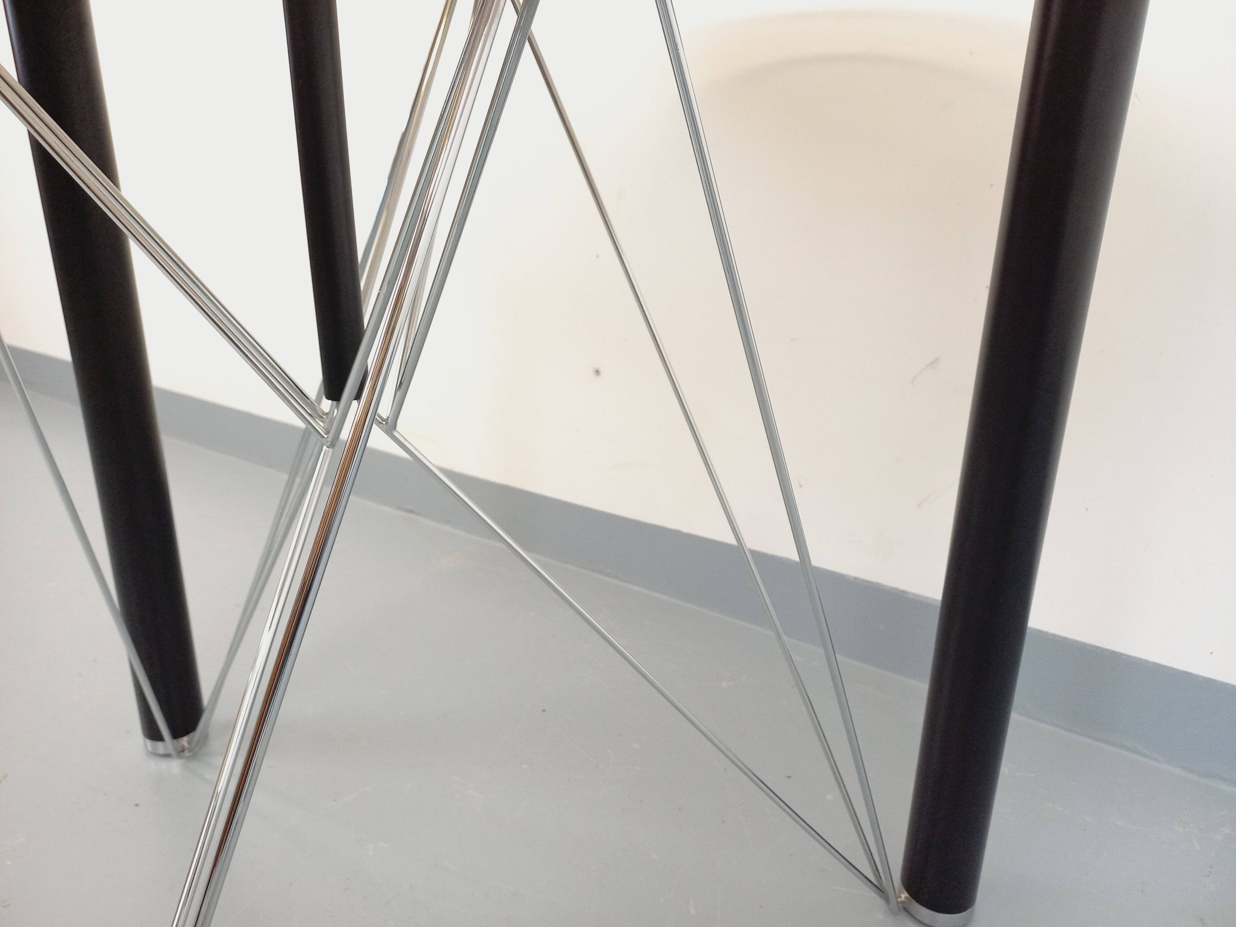 Vintage round dining table in smoked glass, black metal and chrome metal.