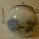 Teapot or coffee maker in old enamelled sheet metal