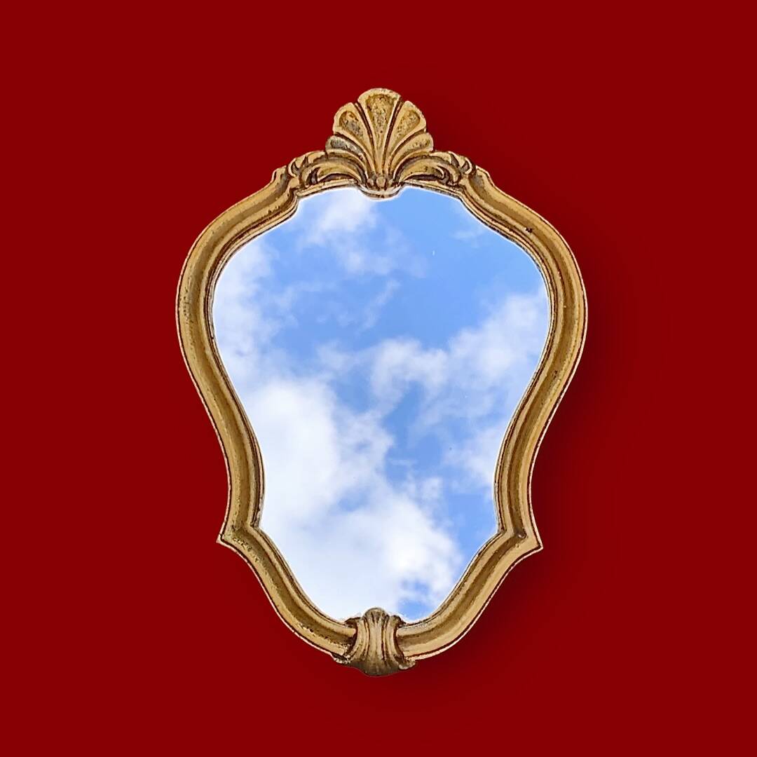 Small vintage rockery wall mirror in golden resin