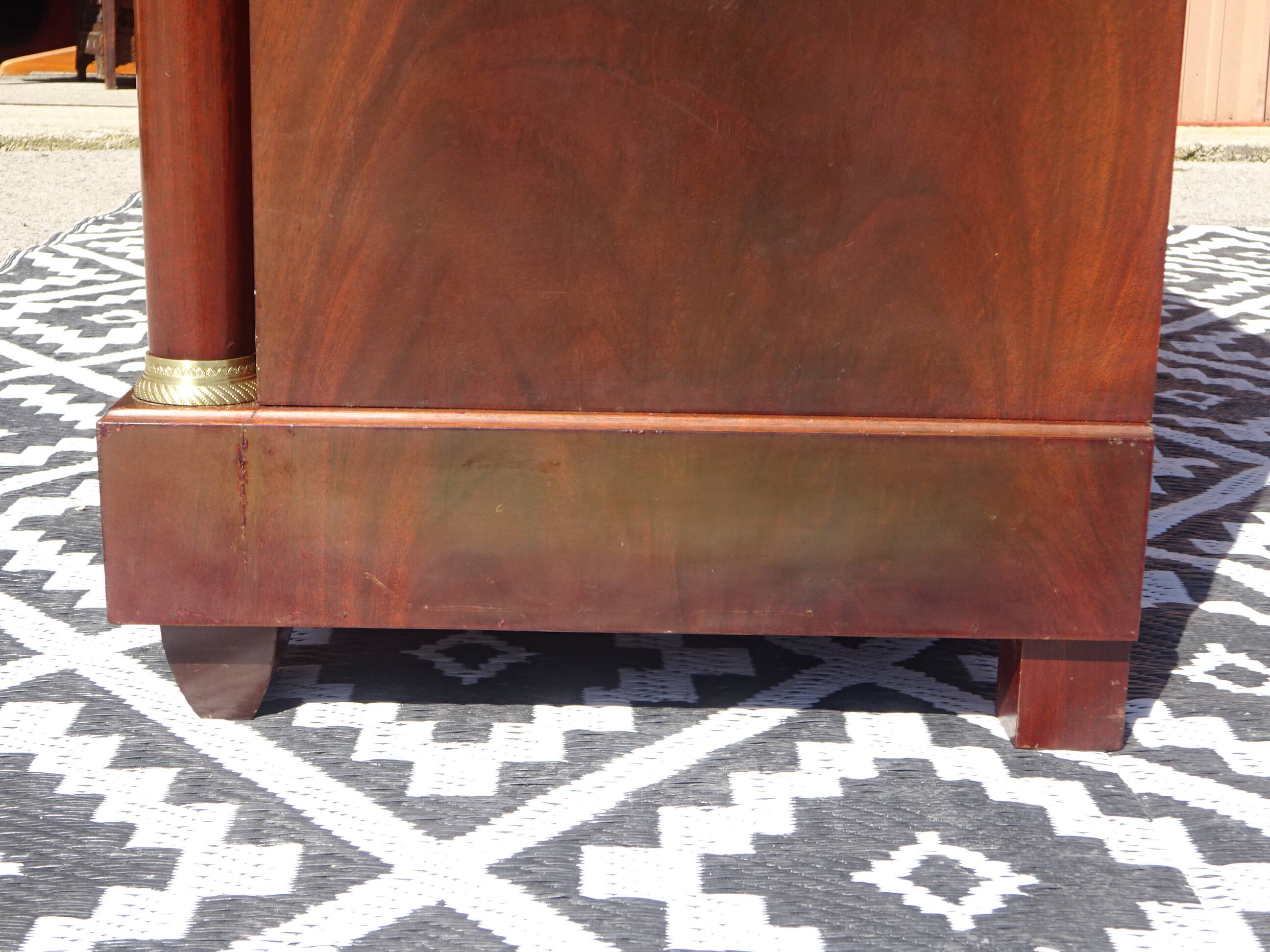 Flamed mahogany enfilade with sea green marble in Empire style.