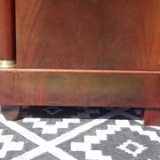 Flamed mahogany enfilade with sea green marble in Empire style.
