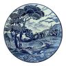 Circular white-blue porcelain dish with animated landscape decoration